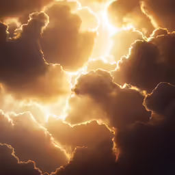 a large cloud filled with bright yellow sunbeams
