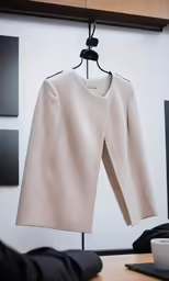 the jacket is hanging on the clothesline