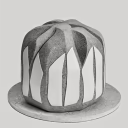 an artisticly designed hat on a stone surface