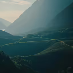 an aerial view of mountains in the distance