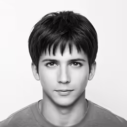 a black and white photograph of a man with dark hair