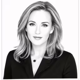 a woman with blonde hair wearing a black shirt