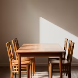 an empty wooden dining table and chair set
