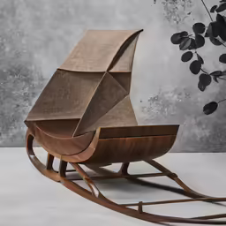 a chair and a rocking toy that is on the ground