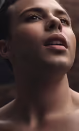 a male with very small round eyeliner and no shirt