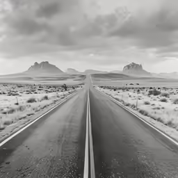 an empty road with two white lines in the middle