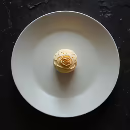 a plate with an appetizer is on a table