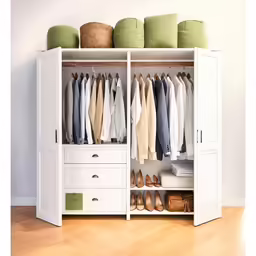 a white closet filled with lots of clothes
