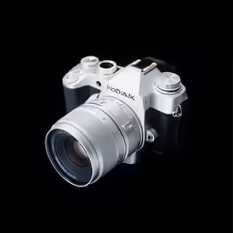 a silver digital camera sitting on top of a table