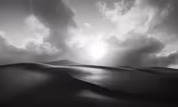 the sun setting over a sand dune with clouds