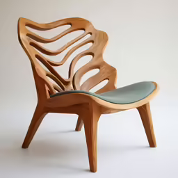 a wood chair with an extended, curved backrest