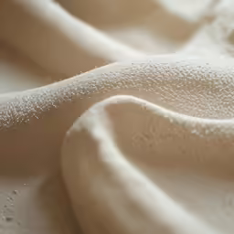 this is a soft white fabric that appears to be fabric texture
