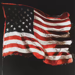 the american flag is falling down in the dark