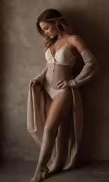 a woman wearing high heels and a body suit
