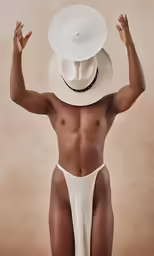 a nude man in a white outfit with his hands up