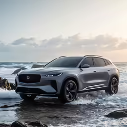 a silver car in the water with a rocky beach