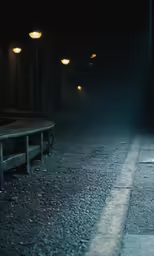 an empty bench and light in the dark