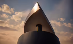 the top of a metal structure against the sky