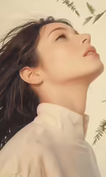 a woman looking up with her hair flowing through the wind