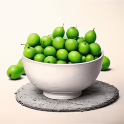 a bowl filled with lots of green apples