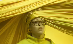 the woman is wearing glasses and looking ahead