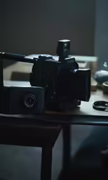 a camera sitting on top of a wooden table