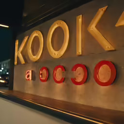 a close up of the words look written on a wall