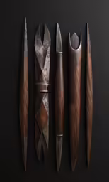 different sized knives and cutting utensils on a black surface