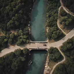 an aerial view of a road over water
