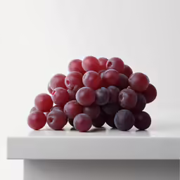 some grapes that are on top of a table