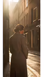 a woman in the sun walking down the street