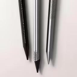 three different types of pen sitting on top of each other