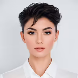 the young woman is posing in front of the camera