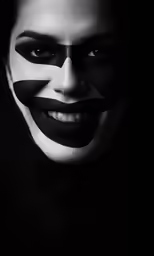a man with a makeup make up and black face