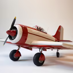 an old school looking airplane with wheels attached
