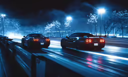two cars on a highway during the night