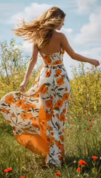 a woman with long hair is standing in a field