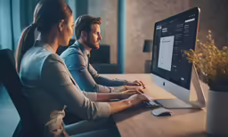 two people looking at a computer screen