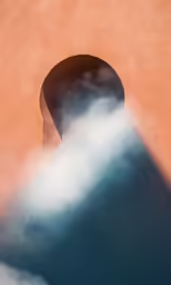 a shadow of the top of a tall building
