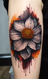 an inked flower is shown in this photo,a tattoo of a flower painted on it