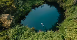 the kayak is just below the edge of the river