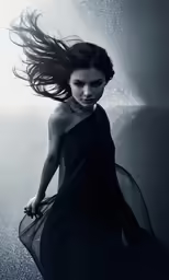 the woman is posing under water with a flowing dress