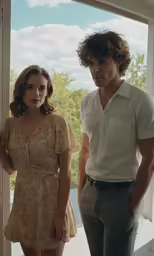 a couple of people standing in front of a glass door
