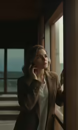 a woman is talking on her cell phone outside