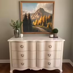 the painting above the dresser is of the mountains