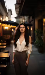 a woman standing on the sidewalk wearing a shirt