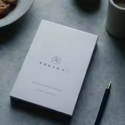 a close up of a book and some food