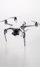 an overhead view of a white quadcopter
