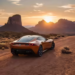 a sports car driving in the desert near a sunset