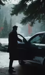 a man opening the hood of a car